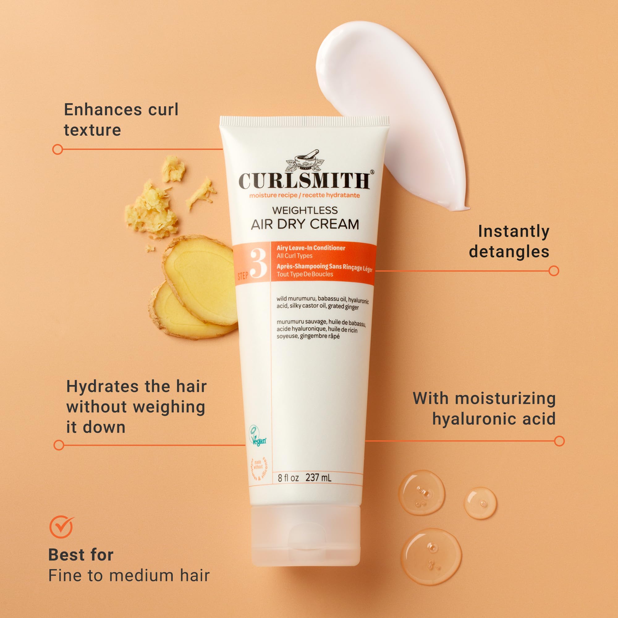 CurlSmith Weightless Air Dry Cream texture on fingers showing silky slip for easy application.