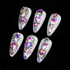 Cycullinyt pickup pen and tweezers for precise crystal placement on nails.