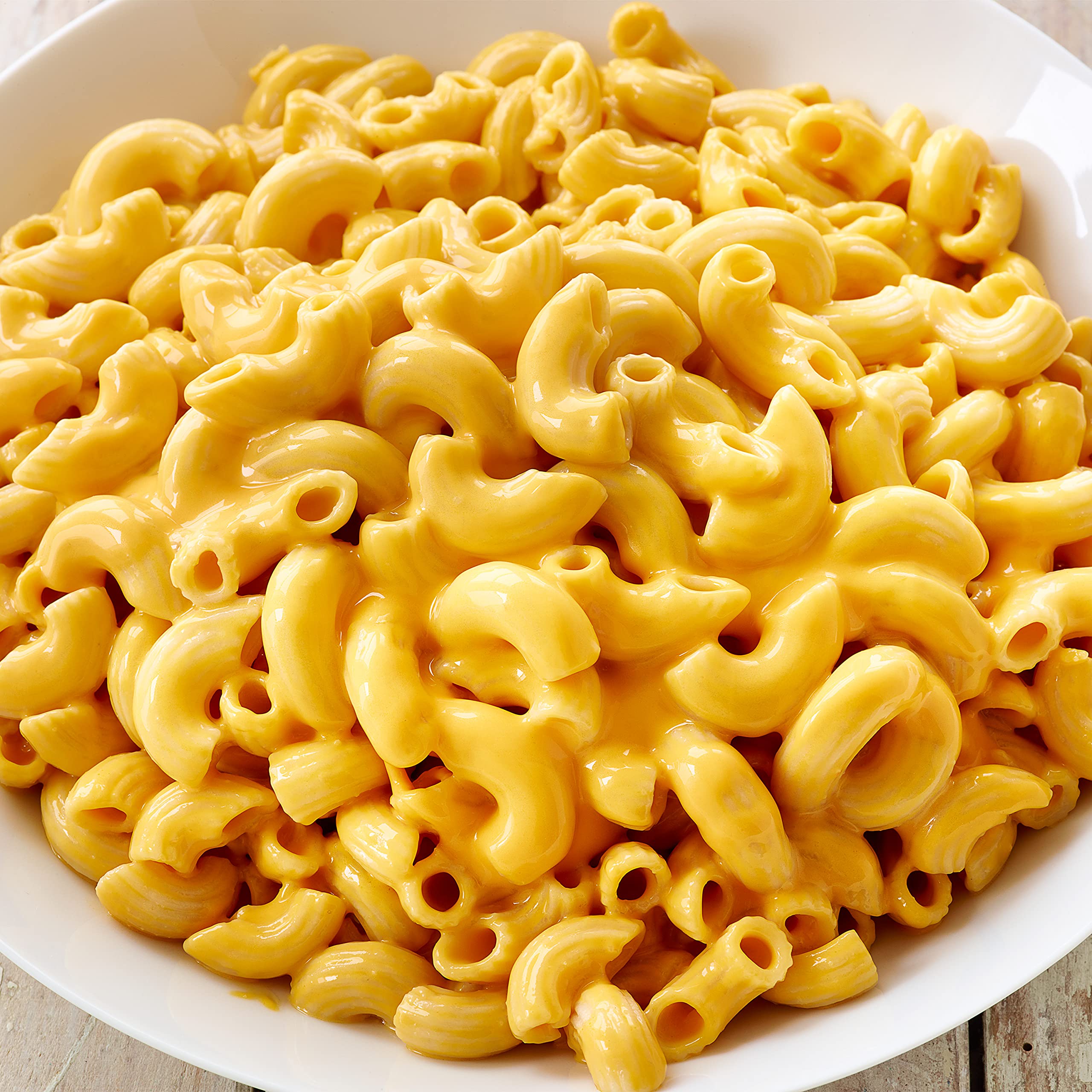Gluten-free noodles in a pot, cooking to tender perfection with Daiya.