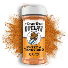 Dan-O's Outlaw Sweet & Tangy BBQ bottle close-up for bold grilling flavor