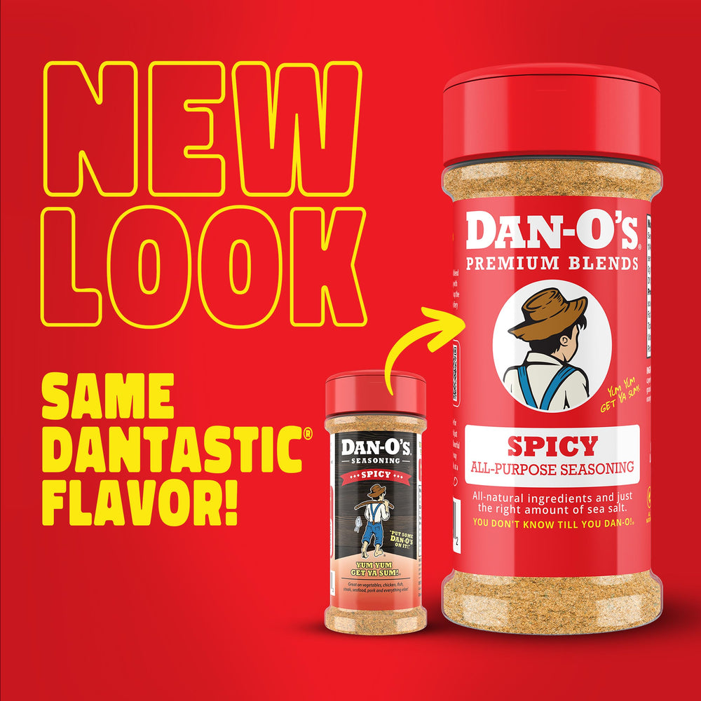 Dan-O's Spicy Seasoning shaker beside grill tools for fast flavor boosts.