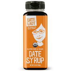Date Lady organic date syrup bottle pour for smooth, natural sweetness in everyday meals.