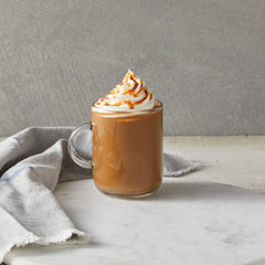 DaVinci Gourmet Classic Caramel Sauce drizzled into coffee for a mocha boost