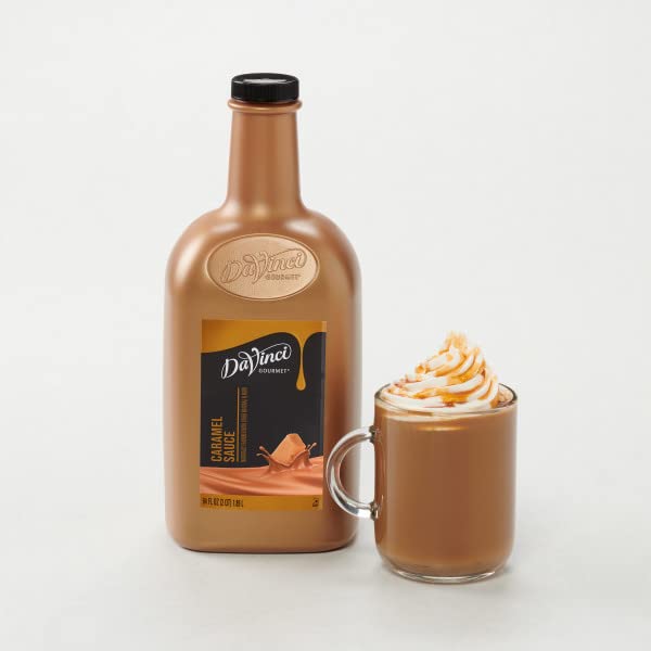 DaVinci Gourmet Classic Caramel Sauce pours smoothly from a bottle onto a cup