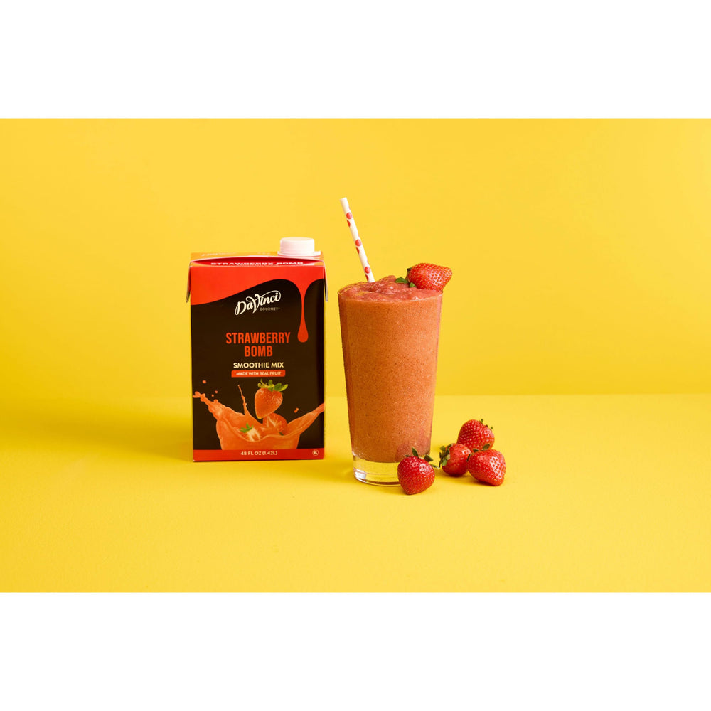 DaVinci Gourmet Strawberry Bomb Smoothie ready in a kitchen with ice and blender.