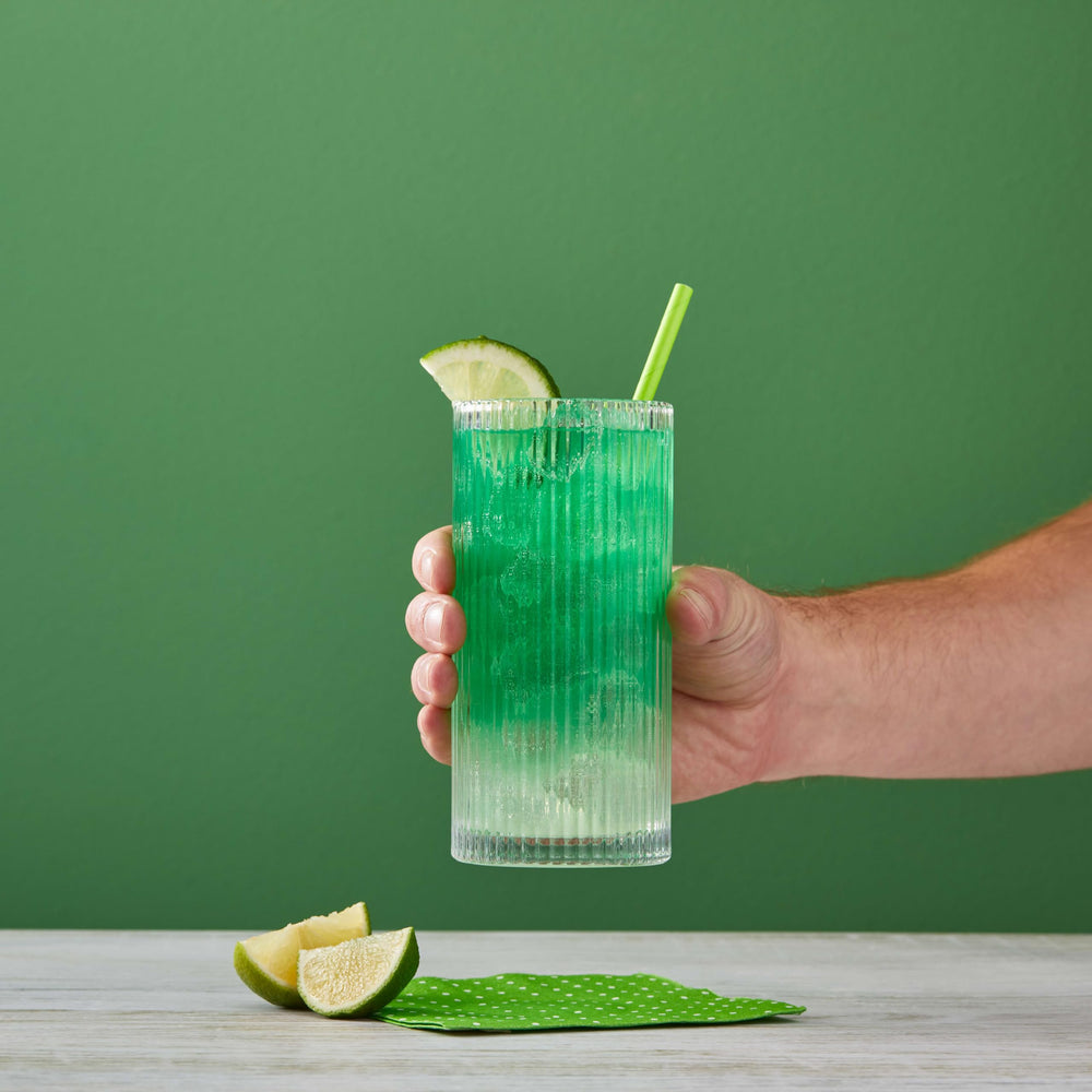 Cocktail glass with DaVinci syrup drizzle for vibrant citrus notes.