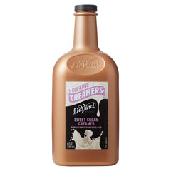 DaVinci Gourmet Sweet Cream bottle pouring into coffee for rich creaminess.