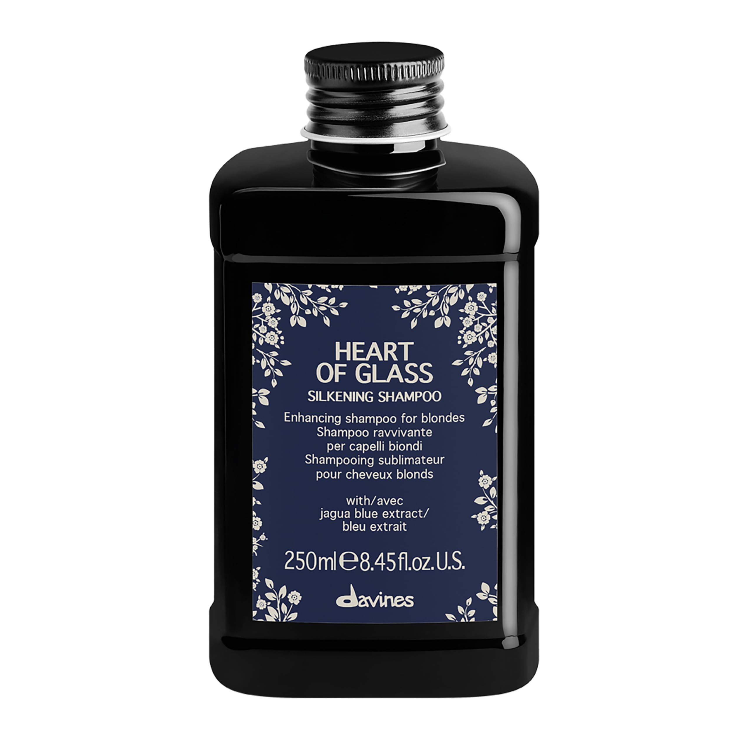Davines Heart of Glass bottle close-up showing silkening formula for blonde care.