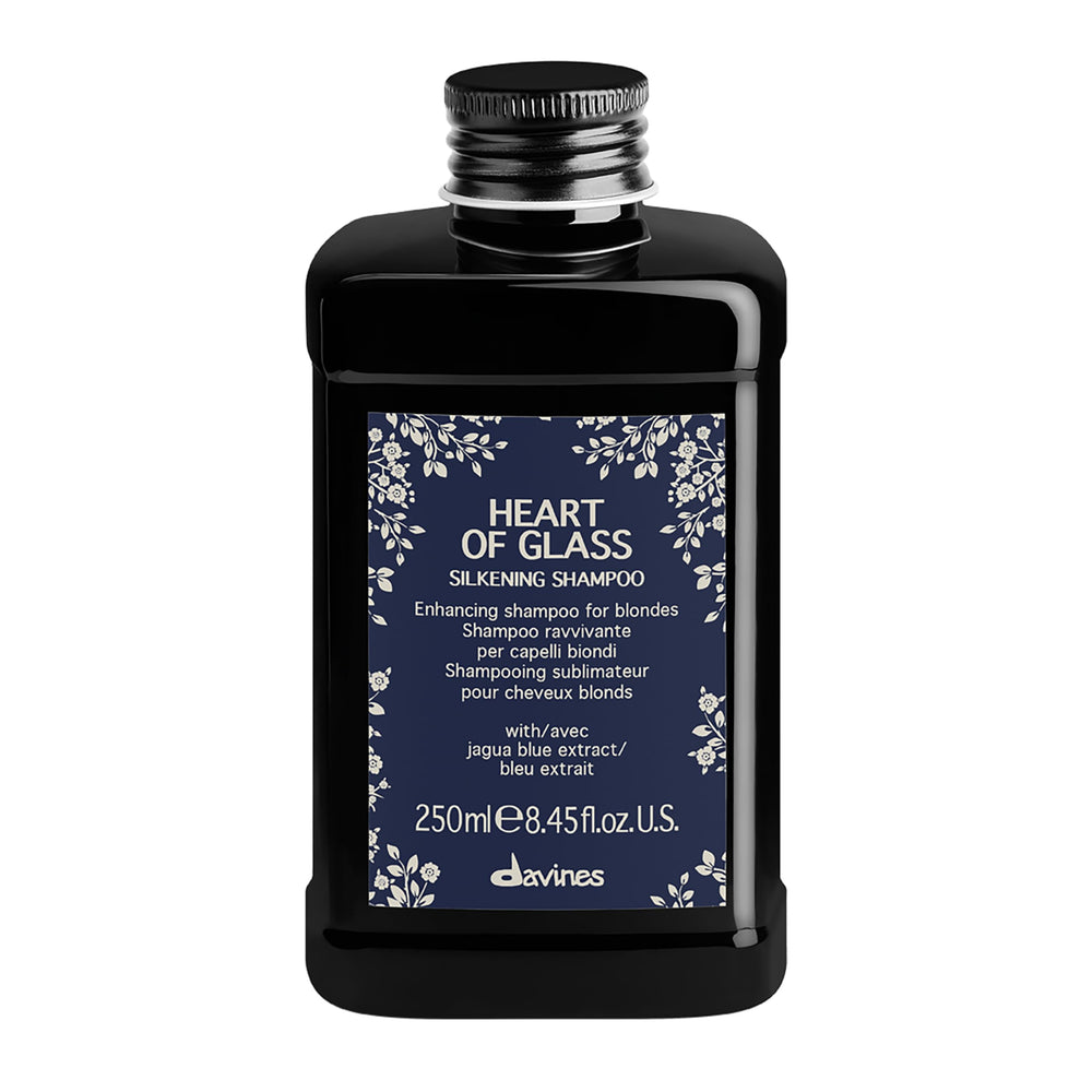Davines Heart of Glass bottle close-up showing silkening formula for blonde care.