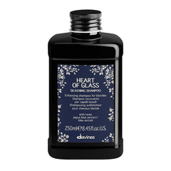 Davines Heart of Glass bottle close-up showing silkening formula for blonde care.