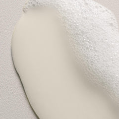 Davines Love Curl Shampoo foam close-up showing creamy lather for textured hair.