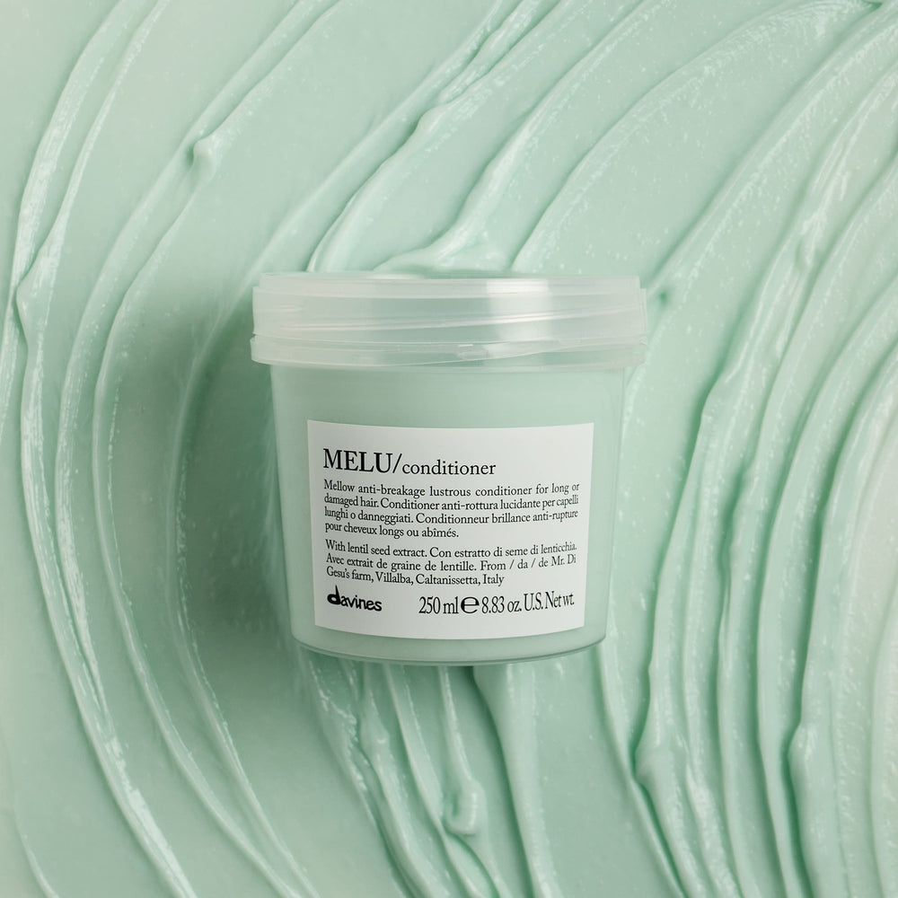 Applying MELU on damp strands smooths ends without weighing hair down.