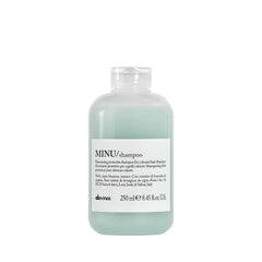 Davines MINU shampoo bottle closeup highlights color protection for treated hair.