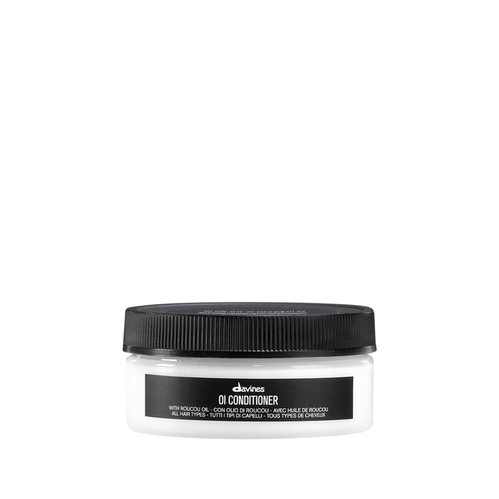 Davines OI Conditioner bottle with rich creamy texture for hydration.