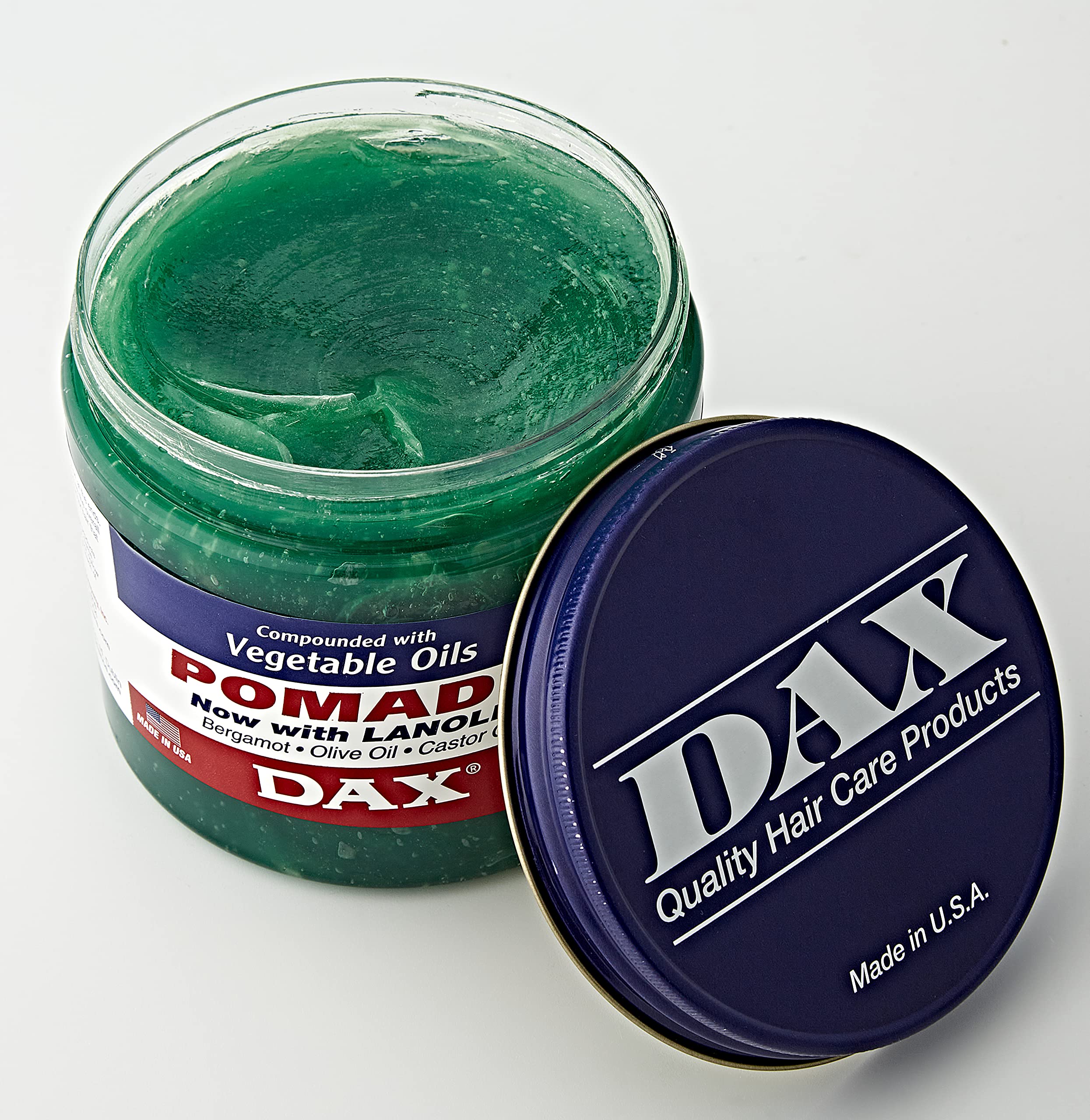 DAX Pomade label highlights suitability for dry and brittle hair