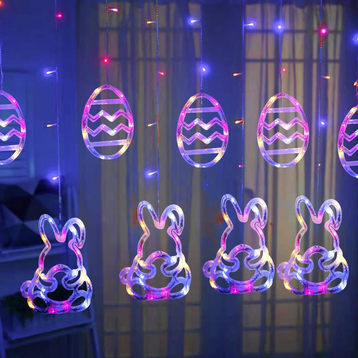 Dazzle Bright Easter Lights curtain display with 12 rabbit and egg shapes on a glass window.