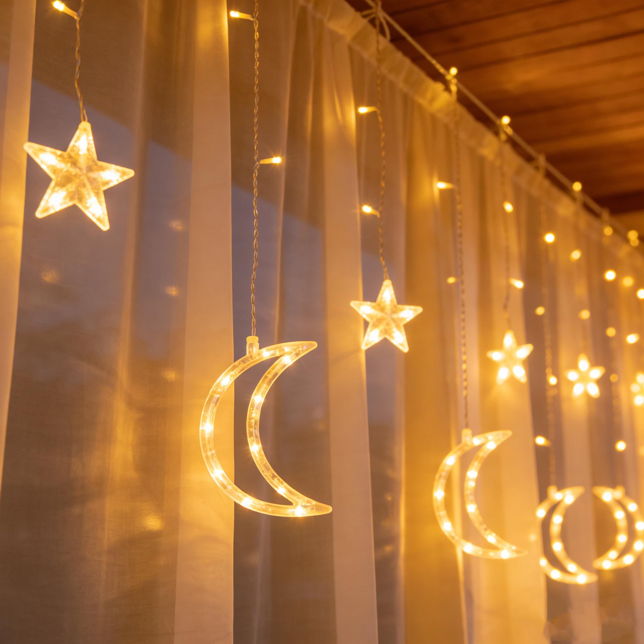 Dazzle Bright star and moon window lights brighten interiors with festive charm.