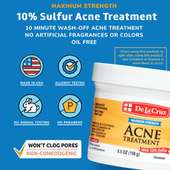 Hands applying De La Cruz Sulfur Ointment to a pimple for spot treatment.
