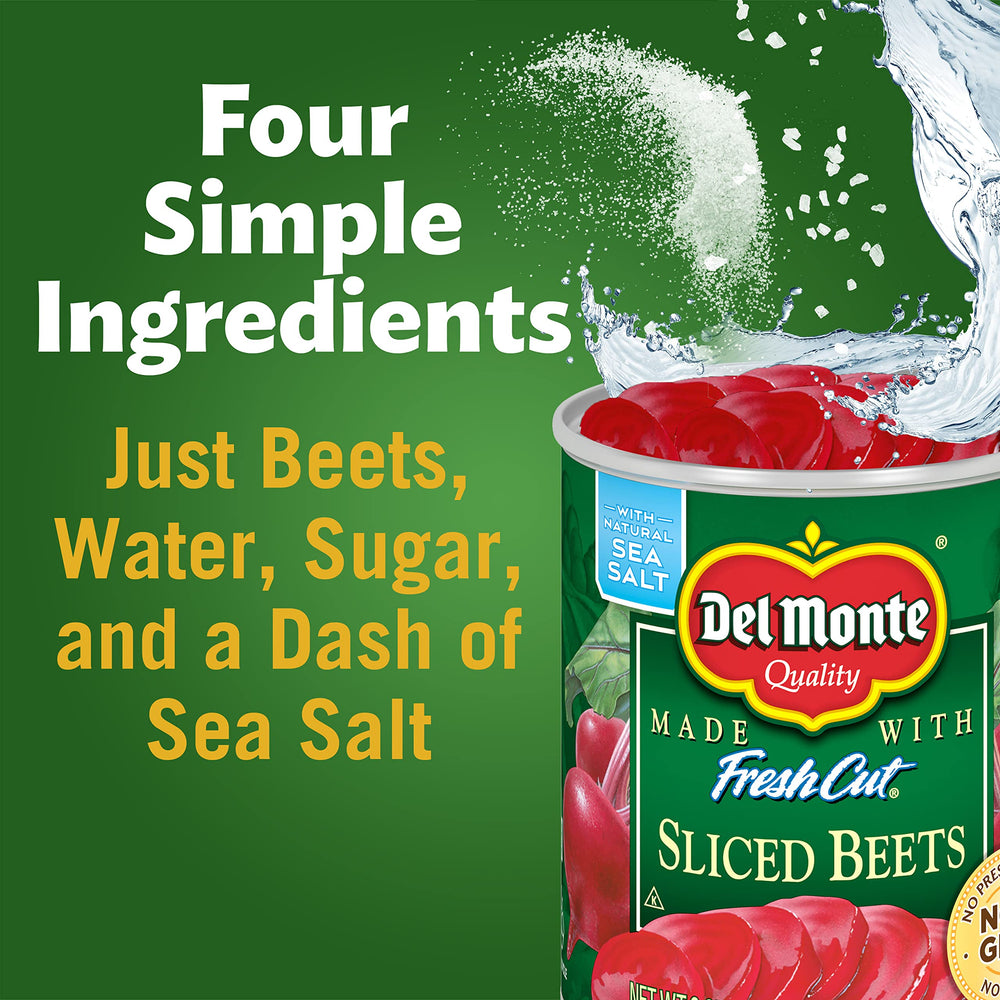 Cans of Del Monte vegetables stacked in a pantry for easy weeknight prep.