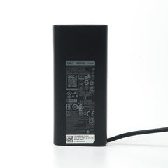 Dell charger label and model plate indicating genuine accessory.