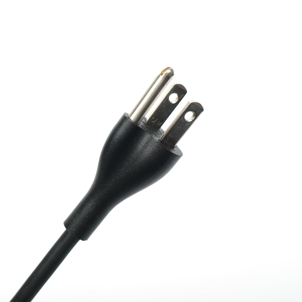 Dell charger connected to outlet with clean cable management