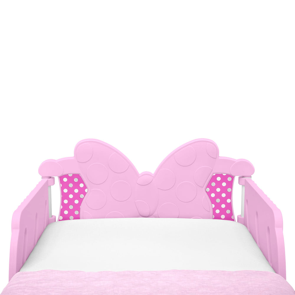 Delta Children Minnie Mouse 3D toddler bed pink durable frame for long-lasting use.