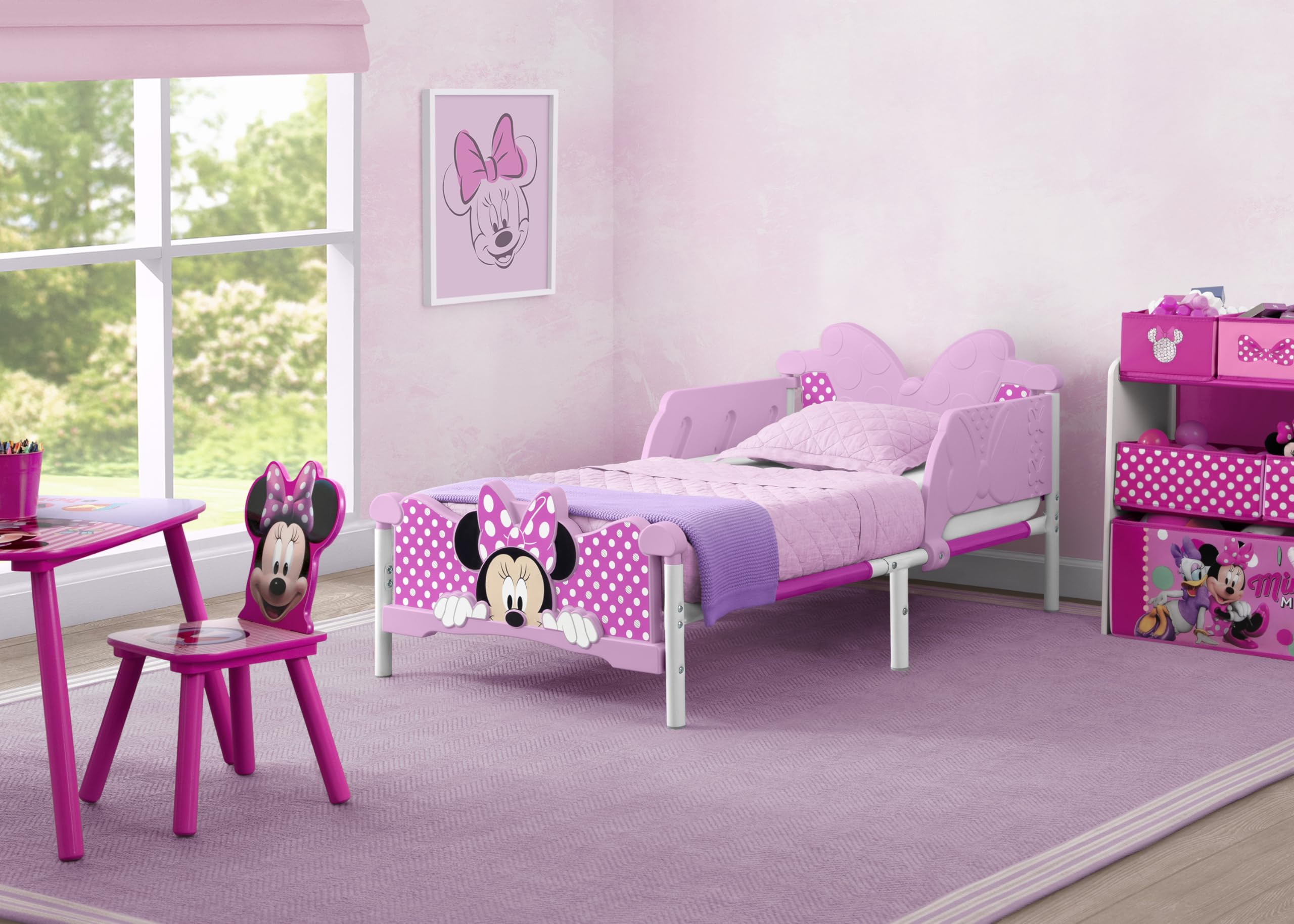Delta Children Minnie Mouse 3D toddler bed pink side rails for safe sleep transitions.