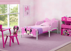 Delta Children Minnie Mouse 3D toddler bed pink side rails for safe sleep transitions.