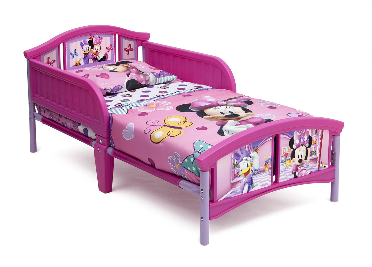 Delta Children Minnie Mouse toddler bed headboard with Minnie and Daisy art for a gentle transition
