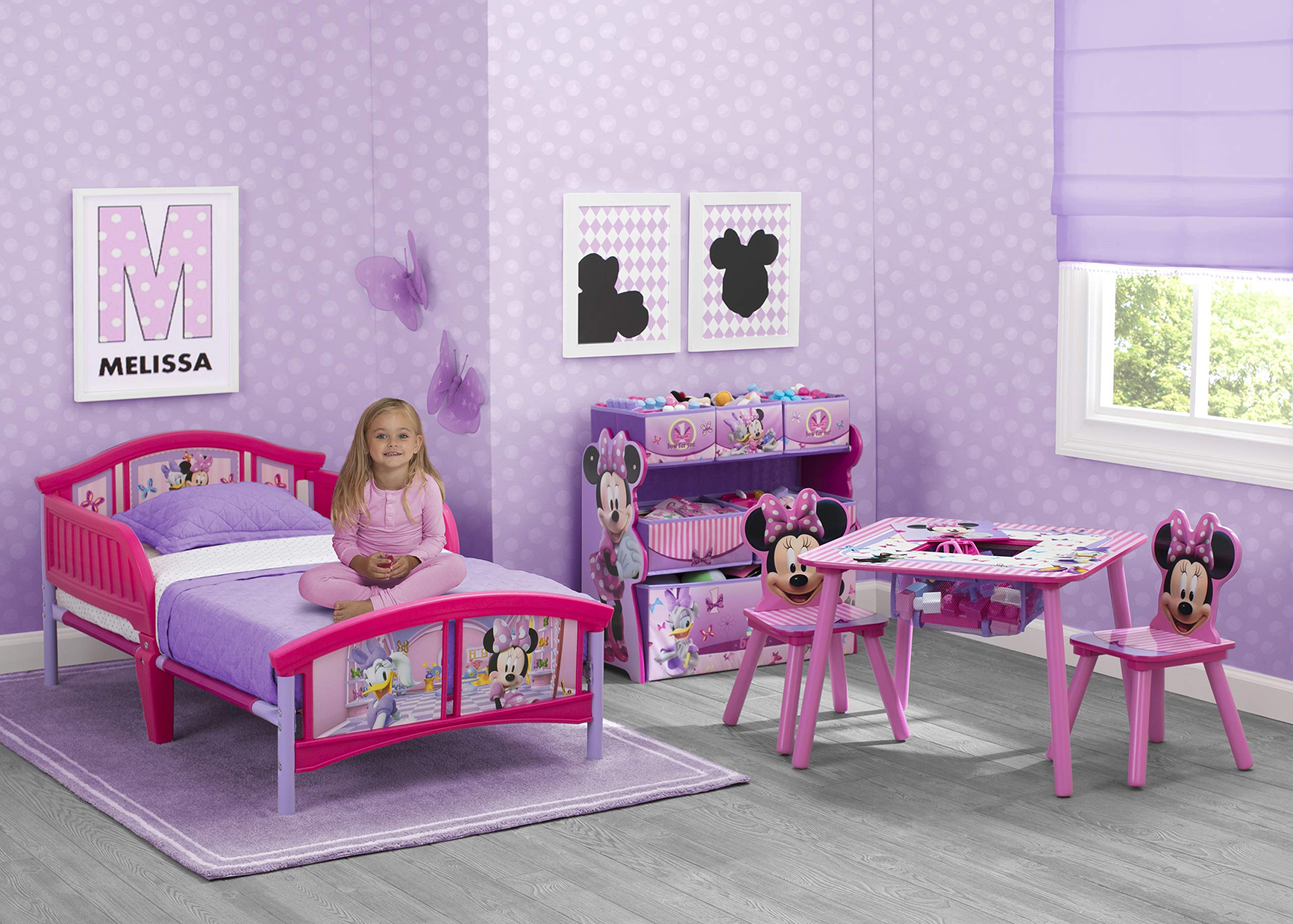 Side view of Minnie Mouse toddler bed showing low height and easy access