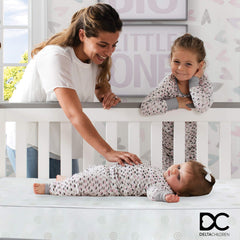 Delta Children Twinkle Galaxy waterproof cover keeps messes easy to clean and sanitary.