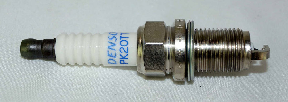 Denso Platinum TT ground electrode detail highlights titanium-enhanced durability.