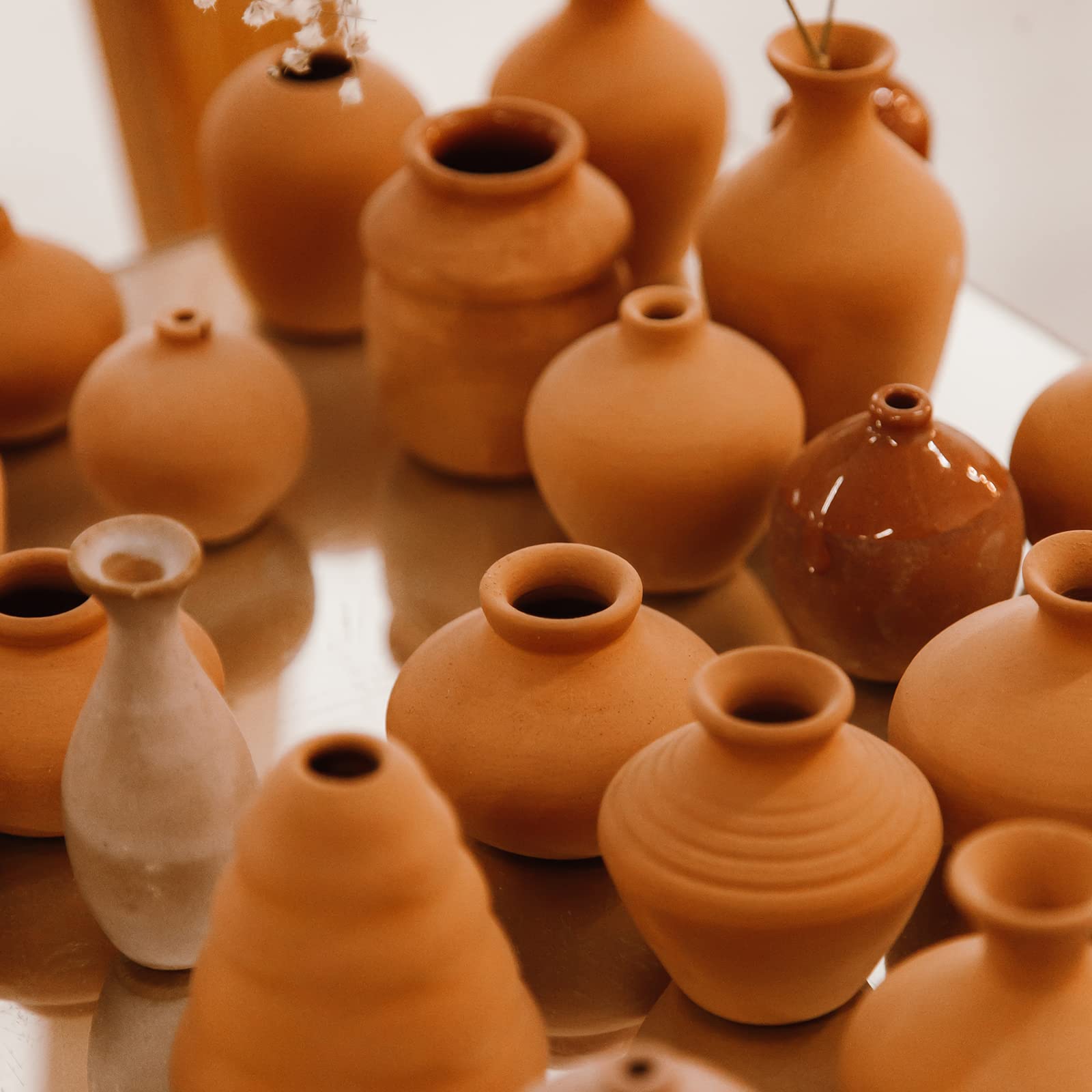 Deouss natural mold notes on moist clay for texture development and plasticization.