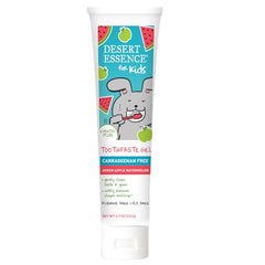 Desert Essence kid toothpaste on a toothbrush highlighting a flavored brushing routine.