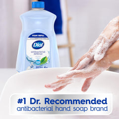 Dial Antibacterial Defense foaming soap close-up showing creamy foam.