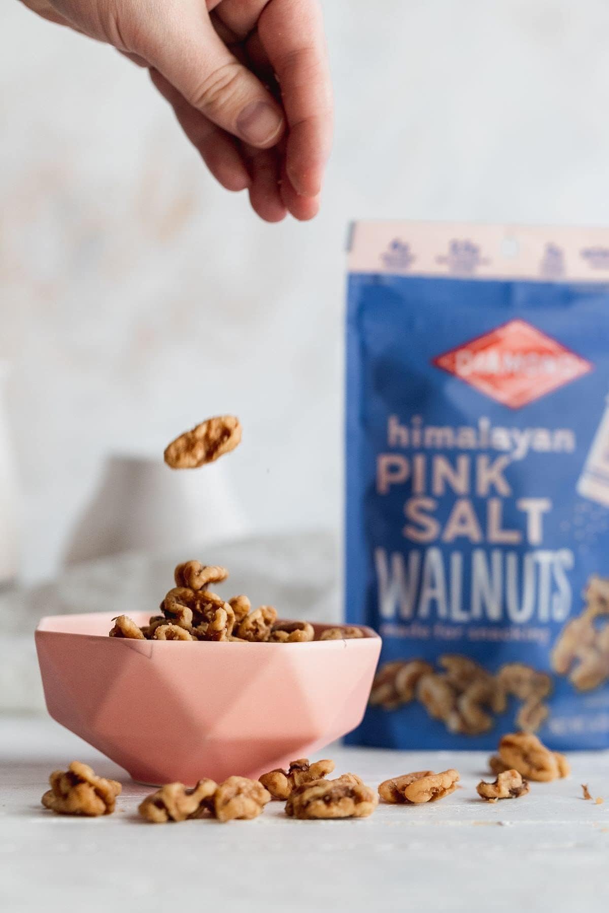 Snack time scene featuring Diamond of California Himalayan Pink Salt Walnut Snack 4oz.