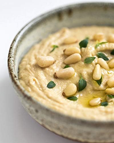 Close-up of Diamond of California pine nuts showing texture for cooking inspiration.
