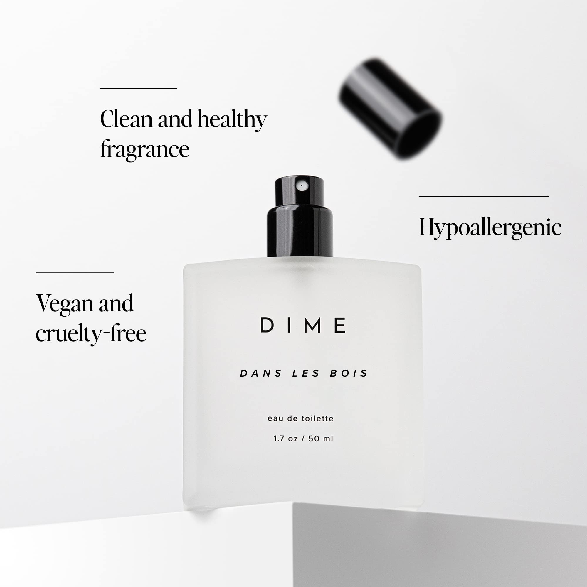 DIME Dans Les Bois spray action captured for a precise, controlled scent release