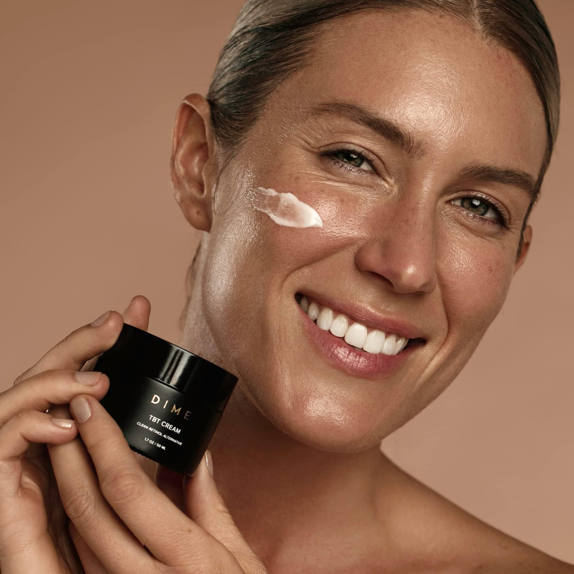 DIME TBT Cream being patted onto skin as part of evening care.
