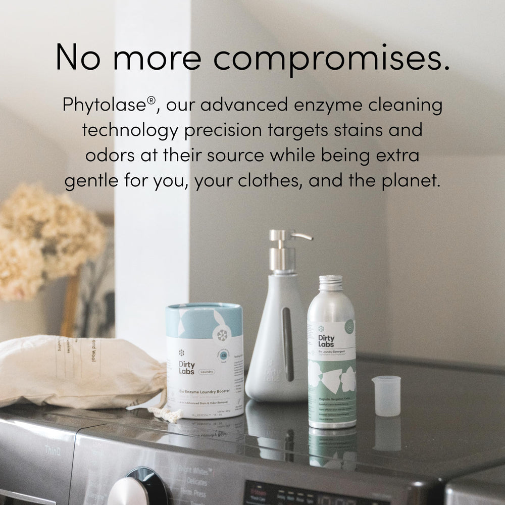 Dirty Labs bio-laundry-booster wooden scoop included for precise dosing.
