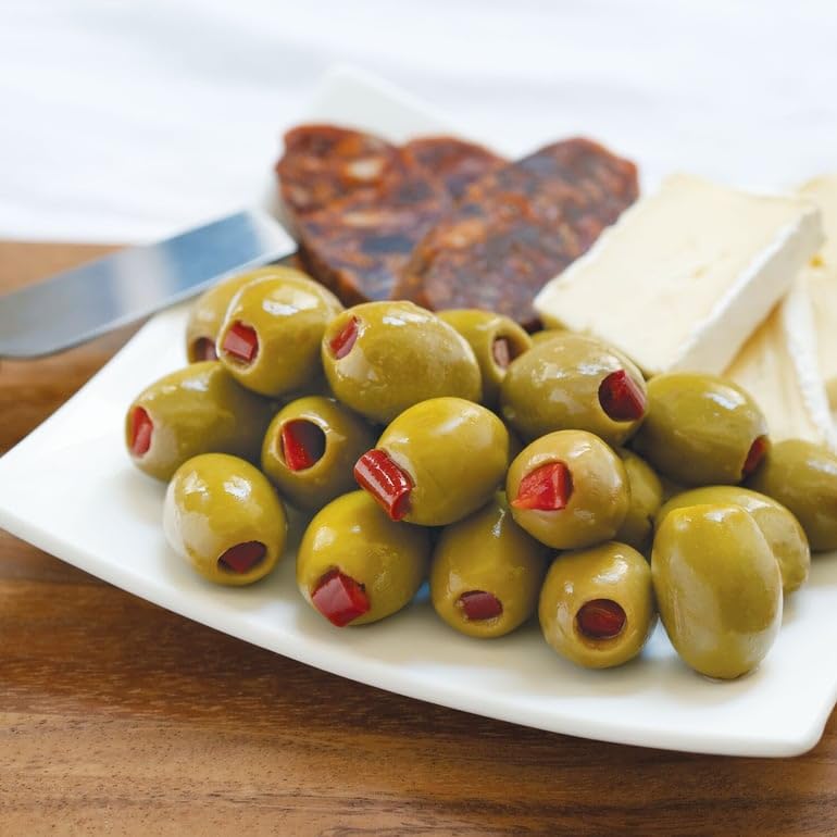 Divina olives with pepper close-up, vibrant flavors for salads or cocktails