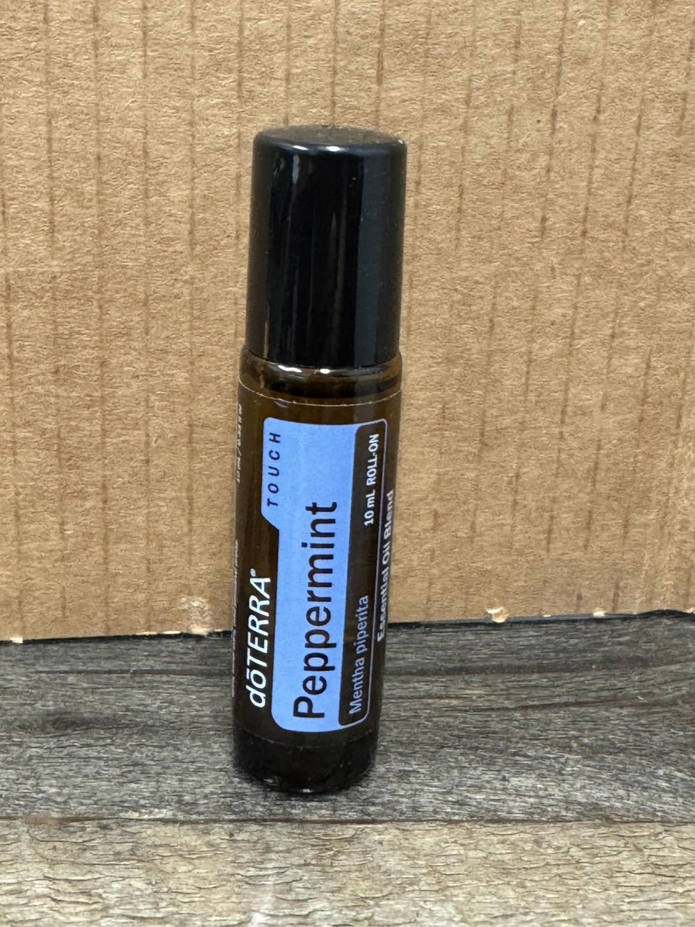 doTERRA Peppermint Touch temple-application showing cooling relief and focus.