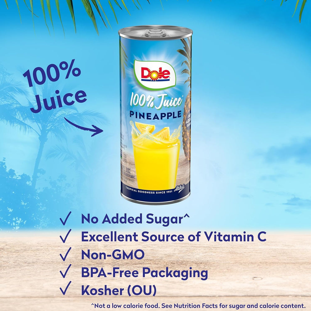 Dole pineapple juice poured into a glass for a tropical drink.