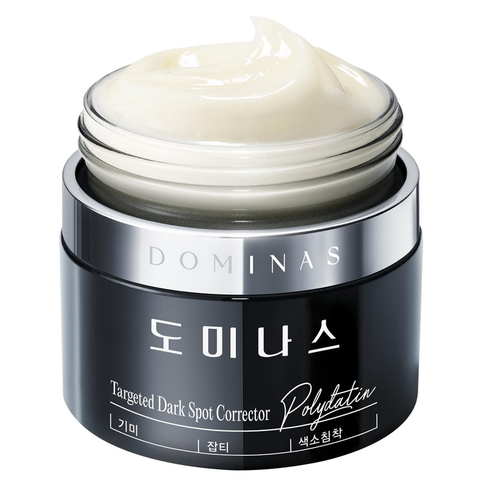 Dominas Dark Spot Corrector Cream tube closeup shows smooth texture and potential even tone for daily care.