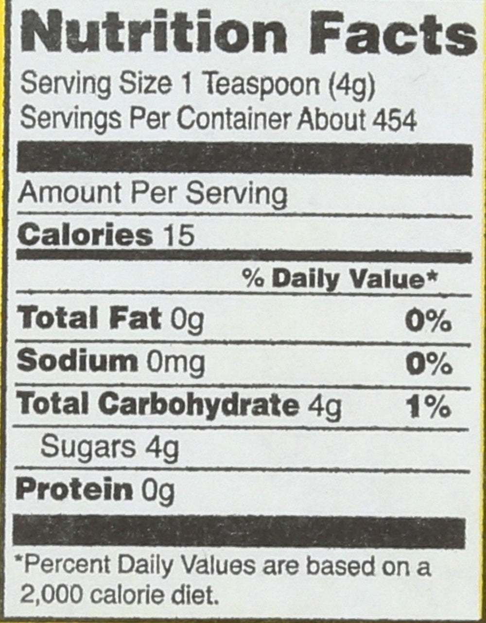 Close-up of Domino sugar granules highlighting fine texture for smooth dissolving.