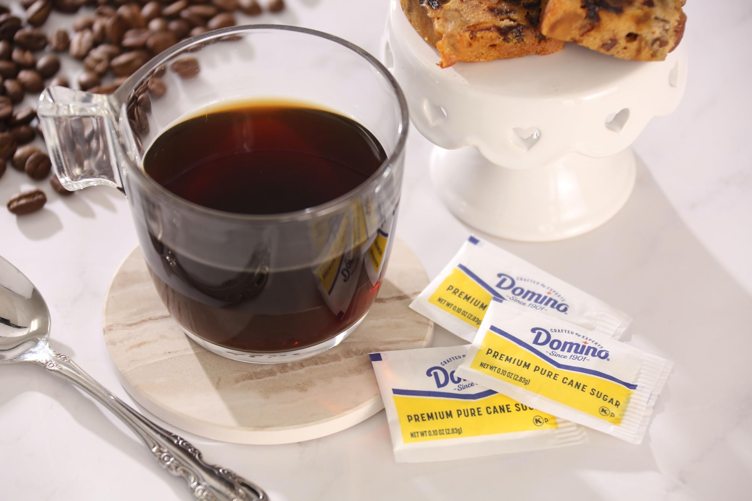 Hotel lobby and front desk amenities with sealed sugar packets.