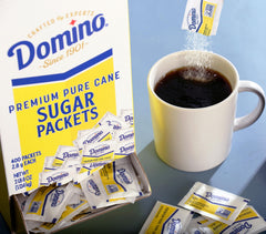 Office breakroom setup with Domino sugar packets for consistent sweetness.