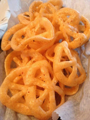 Close-up of Don Turinos Duritos Wheels showing a crackly, puffed texture.