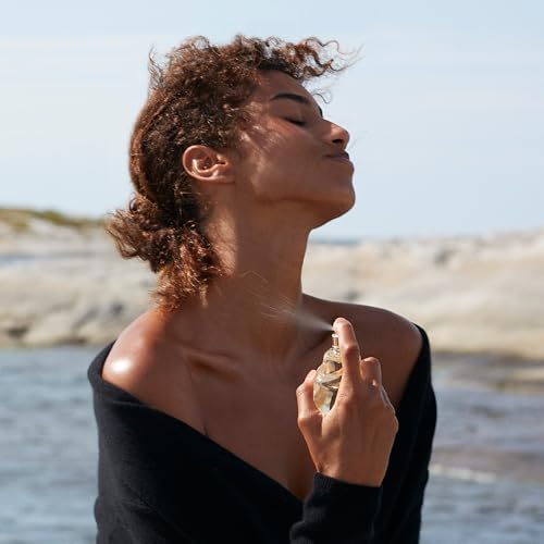 Donna Karan Cashmere Mist close-up shows fragrance and deodorant duo.
