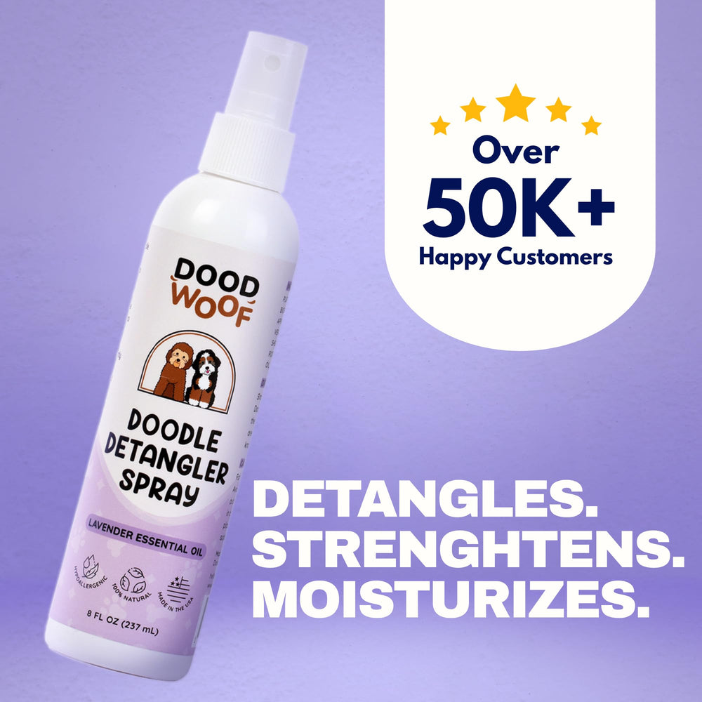 DOOD WOOF detangler spray mist applied to coat for quick detangling.